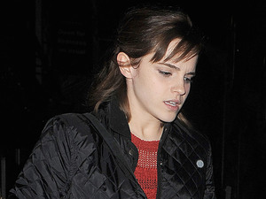 Emma Watson appears rather camera-shy as she walks to her waiting car in Soho.
London, England