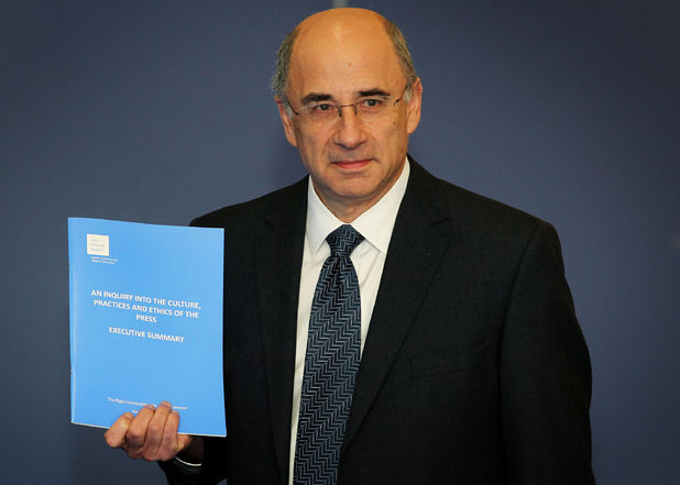 Lord Justice Leveson with the Report from the Inquiry into the Culture, Practices and Ethics of the Press inside the QEII Conference Centre, in central London.