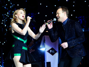 Kylie Minogue and Jason Donovan perform during the Hit Factory Live Christmas Cracker concert, at the O2 arena in London.
