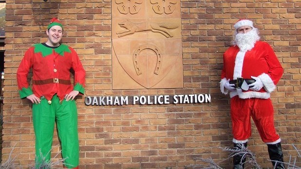 Leicestershire Pc Joe Lloyd and police community support officer Jay Cooper dress up as Santa and an Elf