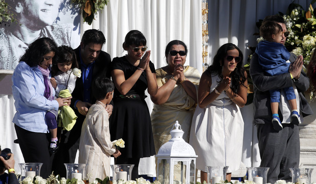 Sukanya Rajan, third from right, is joined by daughter Anoushka Shankar, second from right, stepdaughter Nora Jones, center, and other family members during a memorial service for Ravi Shankar