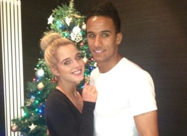 Helen Flanagan and Scott Sinclair pose next to the tree on Christmas Day 2012