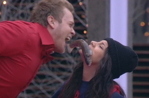Spencer Pratt and Lacey Banghard pass a fish in the 'Against All Odds' task.
