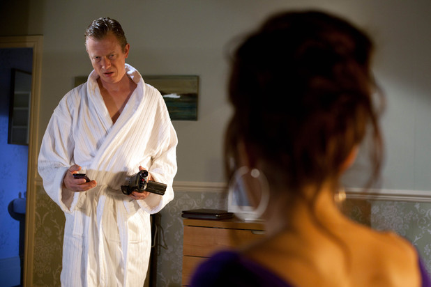 Davies finds camera Mercedes has planted in the hotel room.