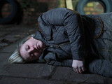 Esther lays unconscious.