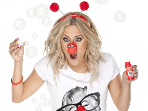 Comic Relief: Caroline Flack wearing a Red Nose Day T-shirt