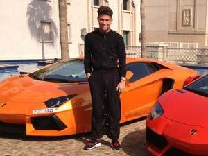 TOWIE's Joey Essex posing by some cars in Dubai
