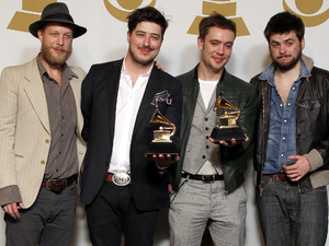 Ted Dwane, Marcus Mumford, Ben Lovett and Winston Marshall of the band Mumford &