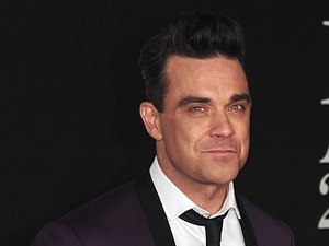Robbie Williams arriving for the 2013 Brit Awards at the O2 Arena, London