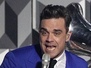 Robbie Williams performs during the 2013 Brit Awards at the O2 Arena, London.