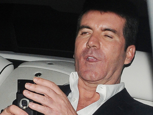 Simon Cowell looking rather worse for wear outside the May Fair hotel for the Penthouse Party, after the live Saturday night 'X Factor' show
