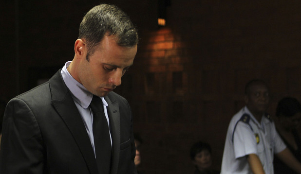 Oscar Pistorius stands in court during his bail hearing at the magistrate court