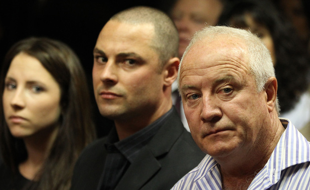 Aimee, Carl and Henke Pistorius watch as Oscar Pistorius walks in during his bail hearing