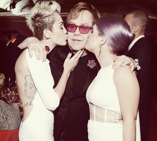 WEST HOLLYWOOD, CA - FEBRUARY 24: (EDITORS NOTE: Image was processed using Digital Filters) An alternate view of actress/singer Miley Cyrus, Sir Elton John and tv personality Kelly Osbourne at the 21st Annual Elton John AIDS Foundation Academy Awards Viewing Party at Pacific Design Center on February 24, 2013 in West Hollywood, California. (Photo by Michael Kovac/Getty Images for EJAF)