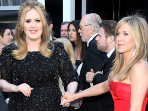 HOLLYWOOD, CA - FEBRUARY 24: (L-R) Adele and Jennifer Aniston arrive at the 85th Annual Academy Awards at Hollywood & Highland Center on February 24, 2013 in Hollywood, California. (Photo by Dan MacMedan/WireImage)