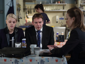 Lucy accompanies Ian to a meeting with a financial advisor. 
