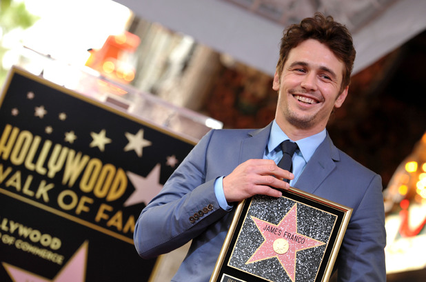 A smiling James Franco poses with his new star at the Hollywood Walk of Fame