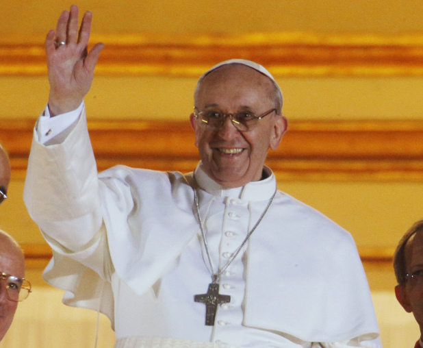 Pope Francis waves to the crowd from the central balcony of St. Peter's Basilica at the Vatican, Wednesday, March 13, 2013. Cardinal Jorge Bergoglio, who chose the name of Francis is the 266th pontiff of the Roman Catholic Church. 