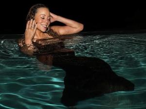 Mariah Carey has "mermaid moment" in pool pictures
