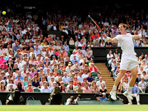 Great Britain's Andy Murray in action against Switzerland's Roger Federer in their Men's Singles Final during day thirteen of the 2012 Wimbledon Championships.