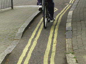 Double yellow lines down a cycle path