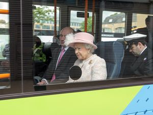 Queen rides on bus