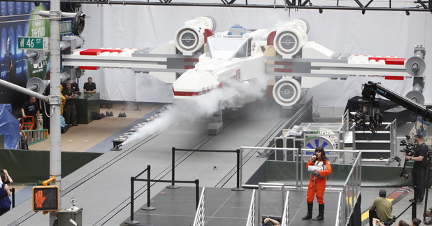 Thousands gather in New York City's Times Square to watch the unveiling of the world's largest LEGO Model, a 1:1 replica of the LEGO Star Wars X-wing Starfighter that took 32 Model Builders, 5.3 million LEGO bricks and over 17,000 hours to complete, Thursday May 23, 2013.