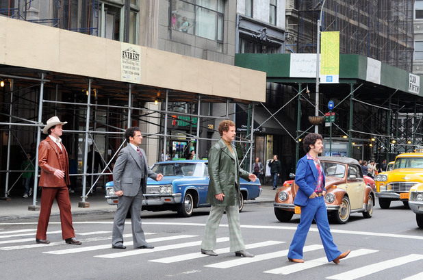 The crew with jerry curls, and parodying Abby Road.