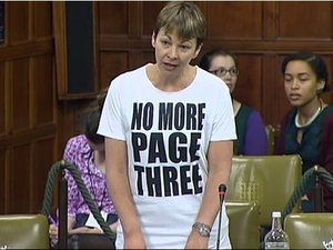 Caroline Lucas wears a 'No More Page Three' T-Shirt