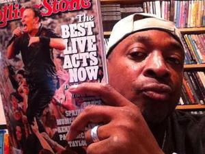 Chuck D of Public Enemy holding a copy of Rolling Stone