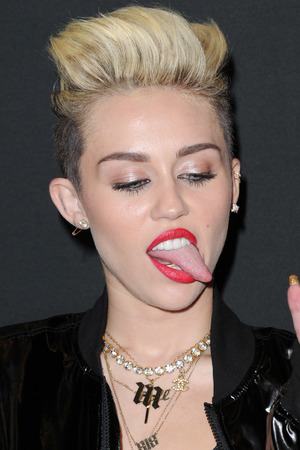 http://i2.cdnds.net/13/35/300x450/miley-cyrus-tongue-4.jpg