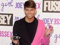 The TOWIE star launches two new perfumes while wearing some unique attire.