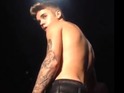 Justin Bieber gets a tattoo of an eagle on his left shoulder.