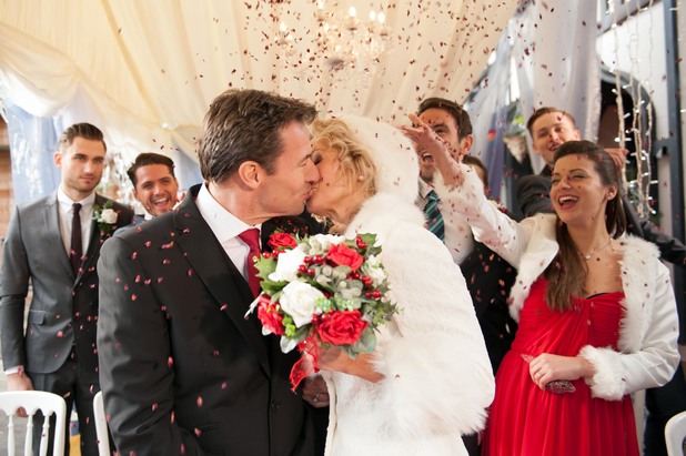 Fraser and Sandy kiss after their vows