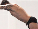 Tom Daley keeps a watchful eye over the popstar in first-look training pictures.