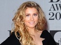 The former X Factor star says boss Cowell is "chuffed" with her album.