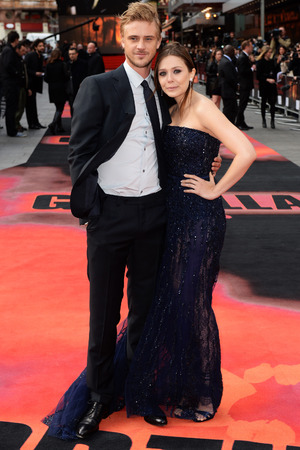 LONDON, ENGLAND - MAY 11: Elizabeth Olsen and Boyd Holbrook attend the European premiere of 'Godzilla' at the Odeon Leicester Square on May 11, 2014 in London, England. (Photo by Dave J Hogan/Getty Images)