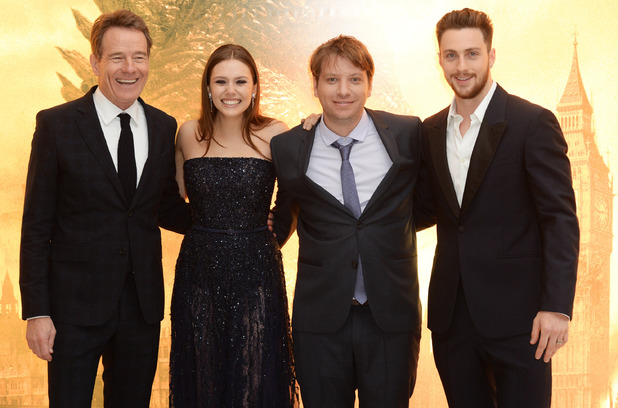 LONDON, ENGLAND - MAY 11: (L-R) Bryan Cranston, Elizabeth Olsen, Gareth Edwards and Aaron Taylor Johnson attend the European premiere of 'Godzilla' at the Odeon Leicester Square on May 11, 2014 in London, England. (Photo by Dave J Hogan/Getty Images)
