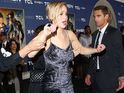 Seriously, what is wrong with her? All the excuses J-Law has given for her clumsy feet.