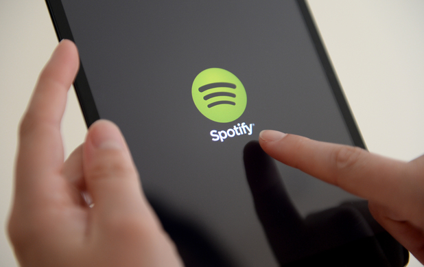 The Spotify App is shown in an Apple iPad mini