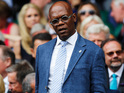 Duo sit in silence next to each other at the 2014 Wimbledon men's championship.