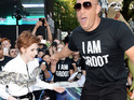 See actor balance on stilts and tower over Karen Gillan at movie premiere.