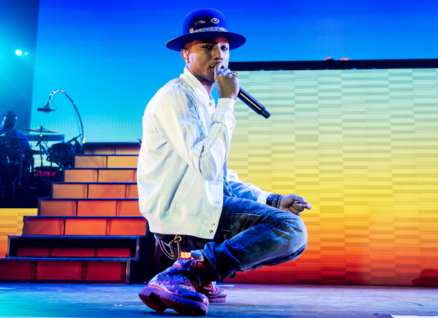 Pharrell Williams performs on stage at 02 Arena on October 9, 2014 