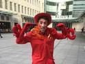 Radio host keeps promise to dress as a crustacean as listeners raise over £500k.