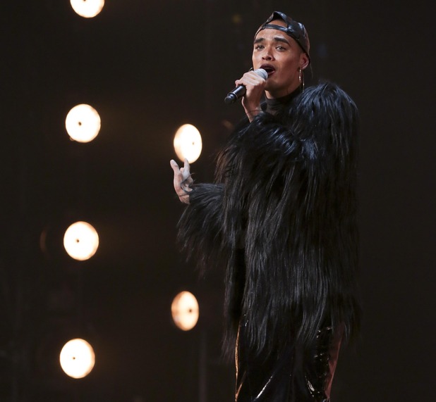 Seann Miley Moore performs for the judges on The X Factor