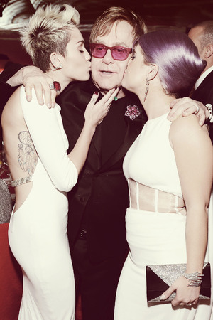 WEST HOLLYWOOD, CA - FEBRUARY 24: (EDITORS NOTE: Image was processed using Digital Filters) An alternate view of actress/singer Miley Cyrus, Sir Elton John and tv personality Kelly Osbourne at the 21st Annual Elton John AIDS Foundation Academy Awards Viewing Party at Pacific Design Center on February 24, 2013 in West Hollywood, California. (Photo by Michael Kovac/Getty Images for EJAF)