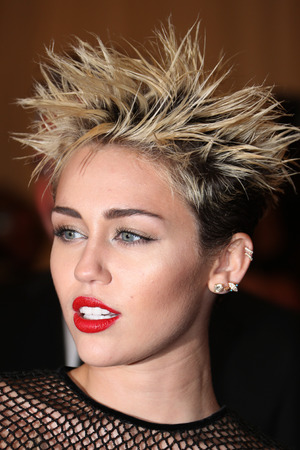 Miley Cyrus shows off spiky hair in nude dress at Met Ball - Celebrity ...